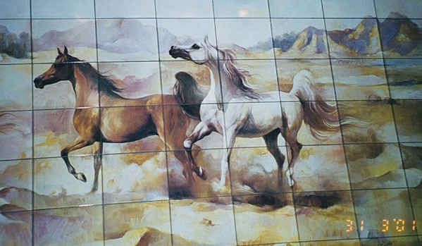 mural depicting Arabian horses at Dubai airport